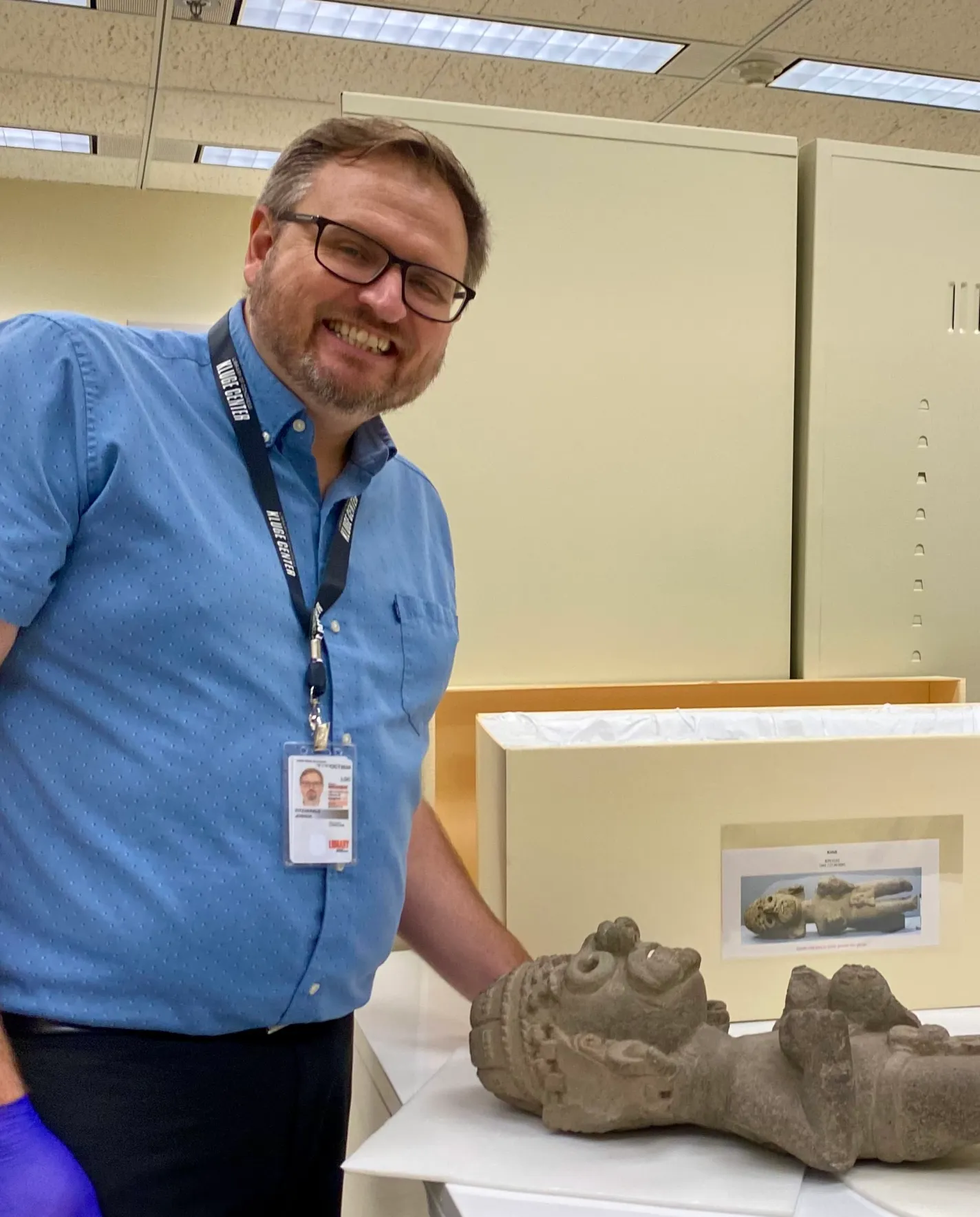 Dr. Fitzgerald examining a pre-Columbian artifact at the Library of Congress